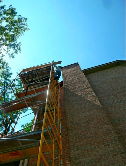 Nicola climbs scaffolding